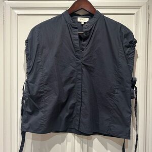 Bohme  brand boxy, black blouse with cinch sleeve ties.